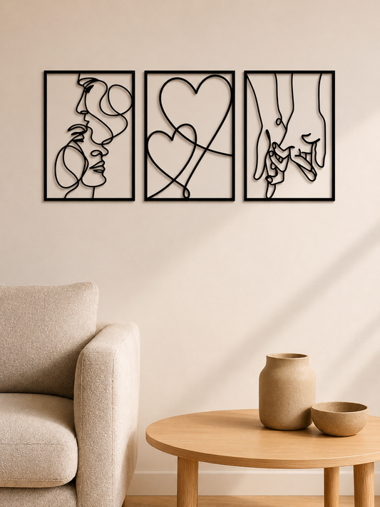 Romantic line art metal wall set with kiss, hearts and holding hands above a cream boucle sofa