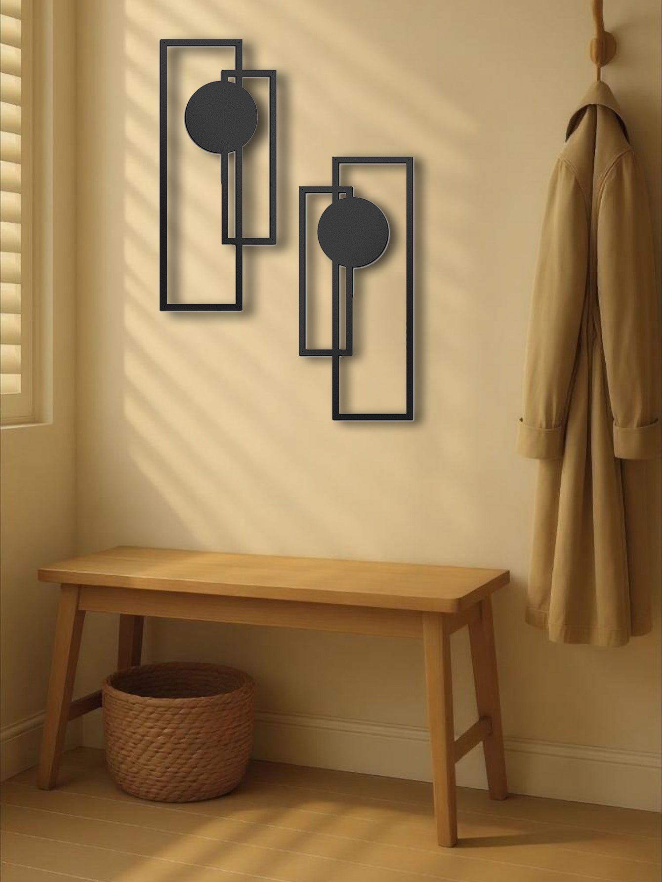 Metal wall decor in a minimalist entryway with wooden bench