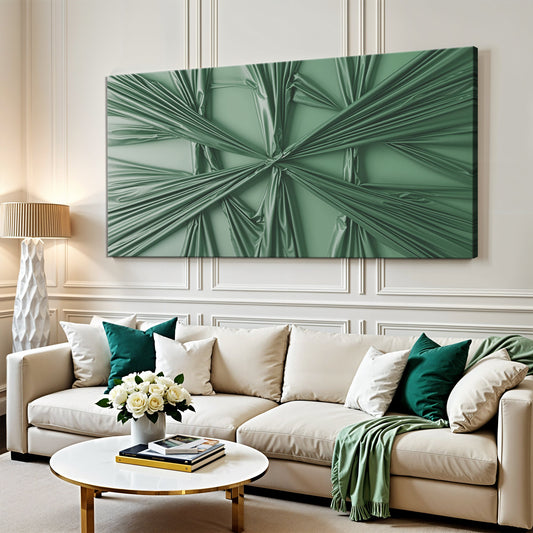 Emerald green draped sculptural canvas wall art above a cream sofa with green pillows and a white rose centerpiece