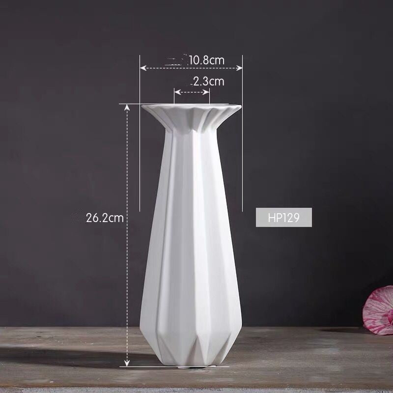 Dimension diagram of the tall white faceted porcelain candlestick holder showing its height and width