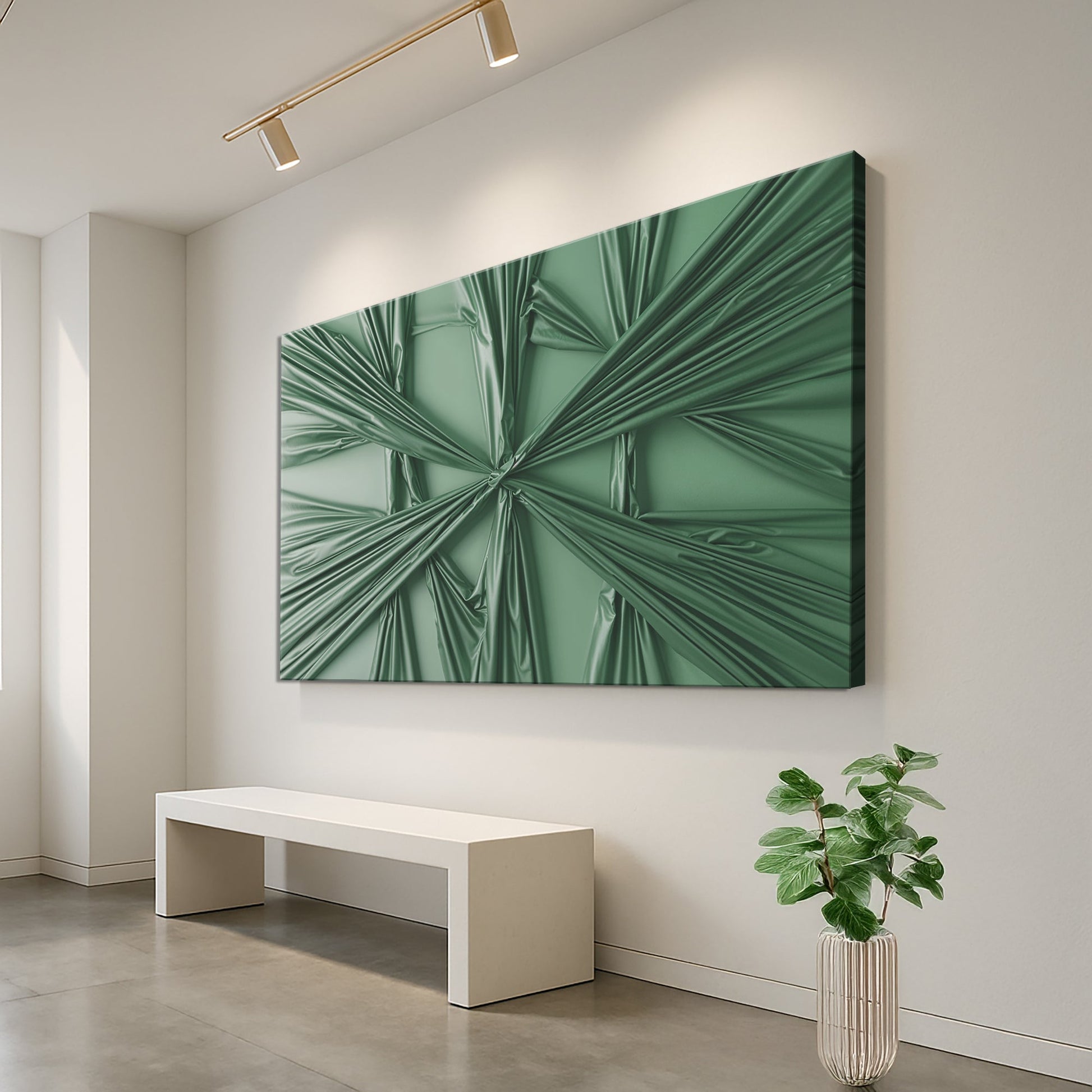 Green sculptural canvas art on a white paneled wall above a bench with a vase of greenery