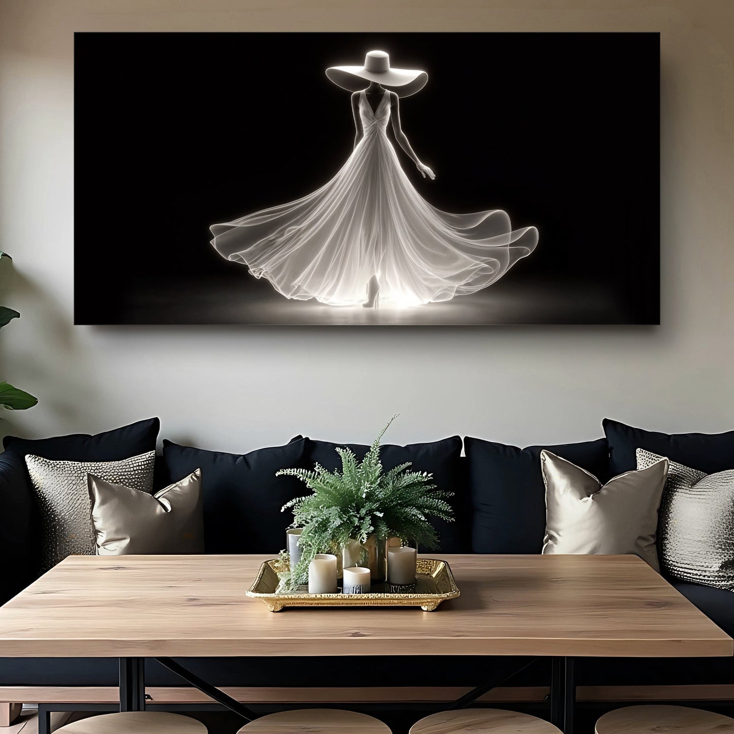 Elegant white silhouette woman canvas art above a sofa with a wood console table and plant