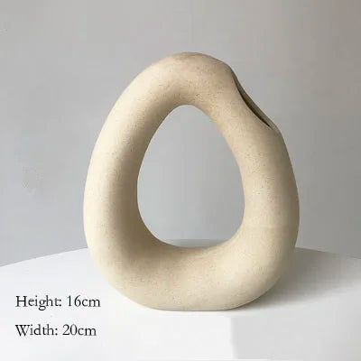 Dimension diagram of the beige sculptural teardrop vase