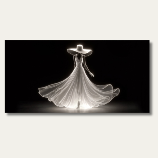 Elegant silhouette canvas wall art of a woman in a wide-brim hat and flowing gown on a warm cream wall