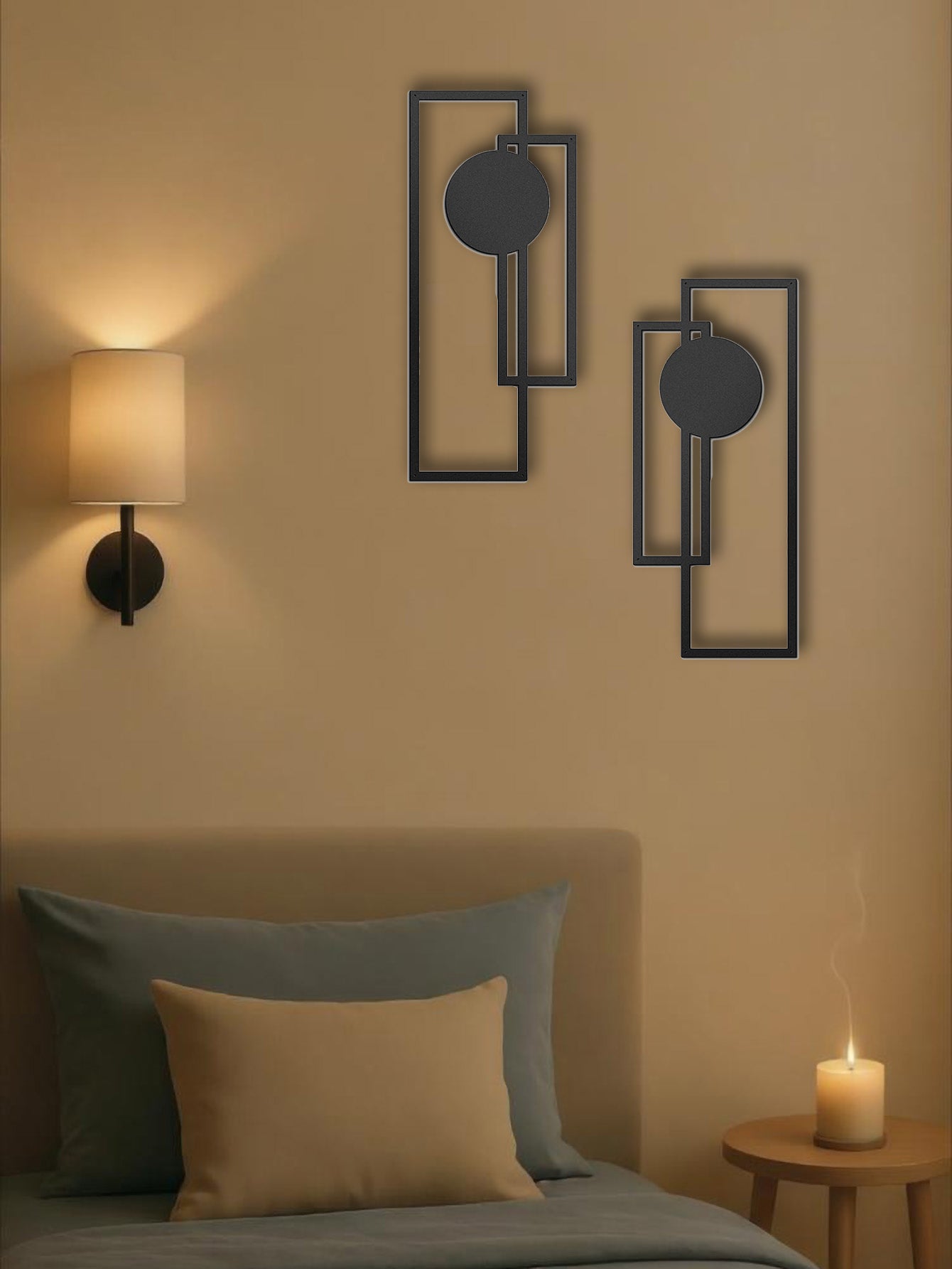 Sculptural metal wall pieces in a minimalist living room with plants