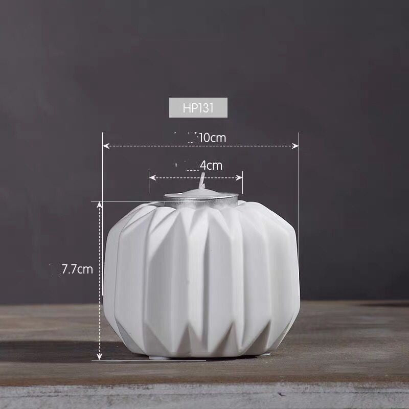 Dimension diagram of the small round white faceted porcelain tealight holder showing its height and width