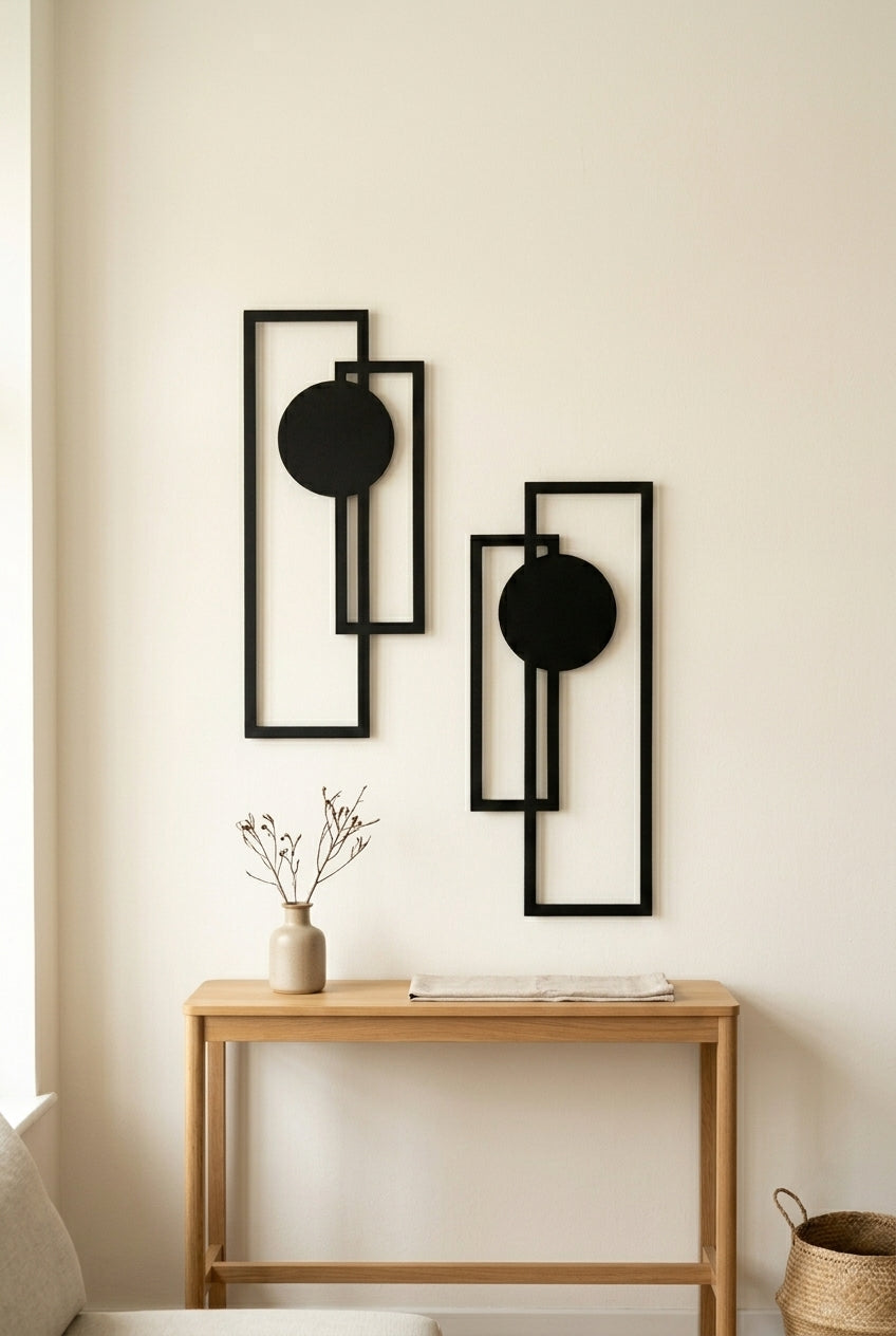 Geometric metal wall decor set hung above a wooden console in a minimalist living room